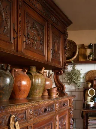 Cottage cucina.

It’s small but ample, with traces of Italian and English charm interwoven with sensory layers:

Texture
Aroma
Flavour
And a warming palette that just glides the eye across hues of brown, green and reds.

Dried herbs from the garden hang above the basket of olive oils, and antique walnut jugs take up all the space of what could be a useful surface; but their enjoyment to touch and look at means so much more. 

Nothing is fitted, with exception to a worktop, because what is more important here is the idea of romantic, unconventional, rustic living. 

The wall colour? That was an easy after-thought once the aesthetic and narrative took root — a deep copper glow, to emulate the film of light on a shaded white wall cast from copper pots hanging in a recess beside the credenza. 

Photography: @rachaelsmithphotographyltd 

#painterly #kitchenstyling #interiorstyling #naturalpalette #colourscheme